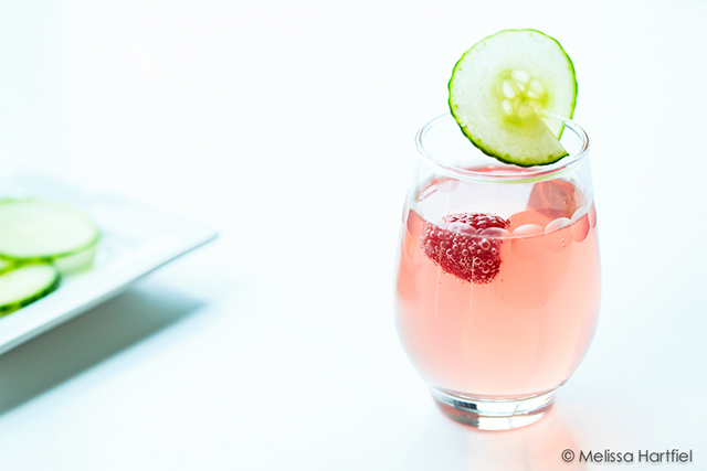 a pink cocktail with bubbles