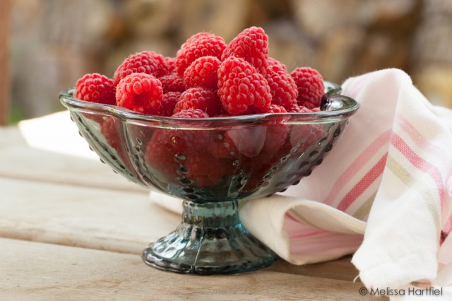 Raspberries in a glass bowl